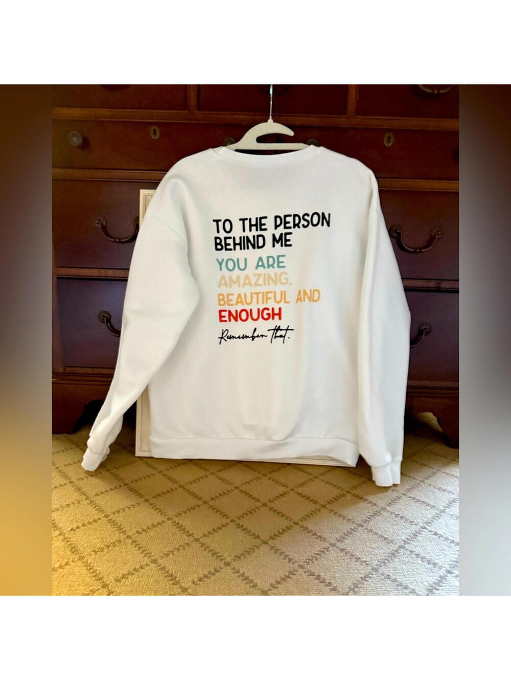 White long sleeved crewneck sweatshirt w motivational text on back XL NWOT